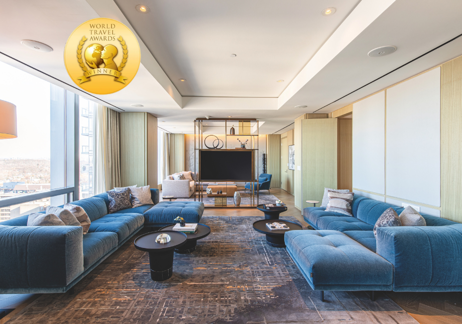 Room in the Four Seasons Hotel Toronto with a World Travel Award badge superimposed on it.